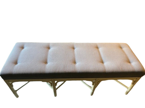 white tufted cushion dining bench with rattan looking wooden legs